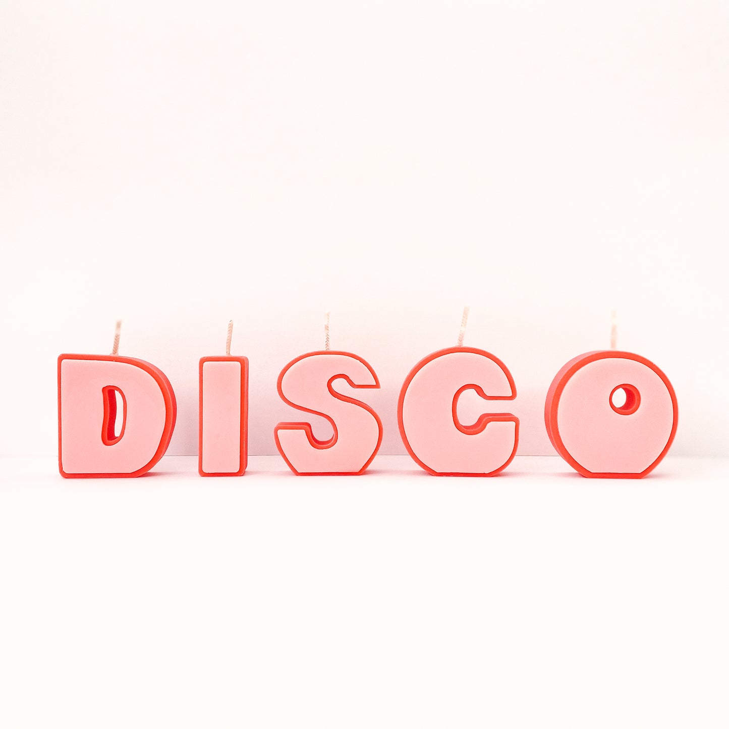 Our Disco Candle is made up of five individual candles. Each one is carefully hand-poured and manufactured by us. With a rose pink center and a cherry red outer, this piece is sure to look incredible no matter how or where you display it.